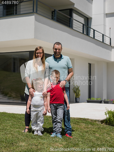 Image of happy family with children in the yard