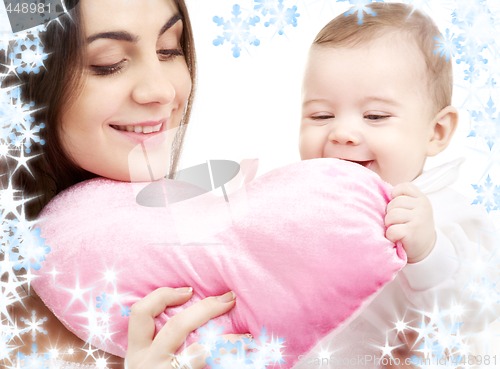 Image of baby and mama with heart-shaped pillow
