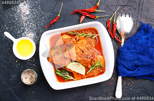 Image of fish with tomato sauce 