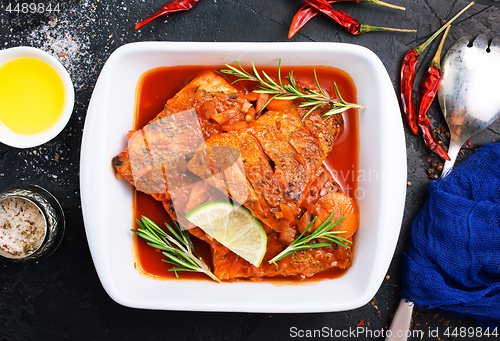 Image of fish with tomato sauce 