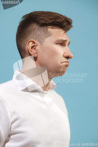 Image of Beautiful bored man isolated on studio background