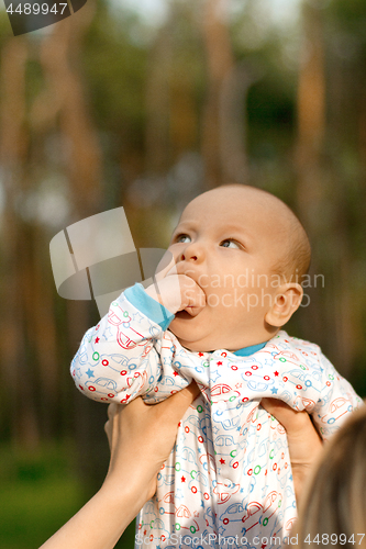 Image of Baby Boy or Girl Have Fun Outdoors