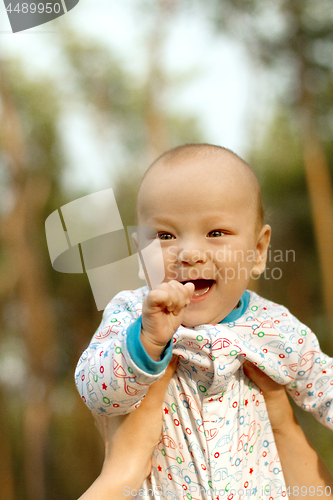 Image of Baby Boy or Girl Have Fun Outdoors