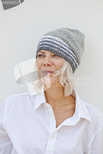 Image of Beautiful young woman in warm grey beanie.