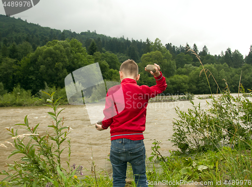 Image of Boy Throw Stones In The River