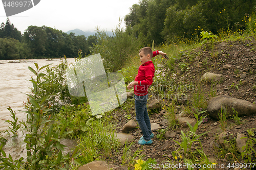 Image of Boy Throw Stones In The River