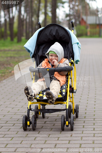 Image of Baby Boy or Girl Sitting in Pram