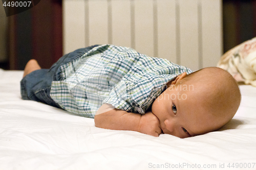 Image of Baby Boy or Girl lying Down in the Bed