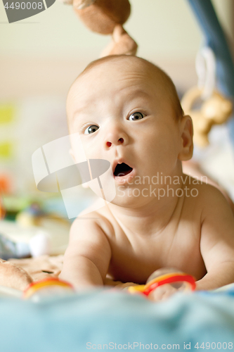 Image of Baby Boy or Girl lying Down in the Bed