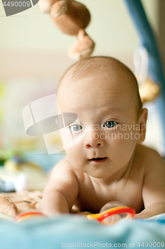 Image of Baby Boy or Girl lying Down in the Bed