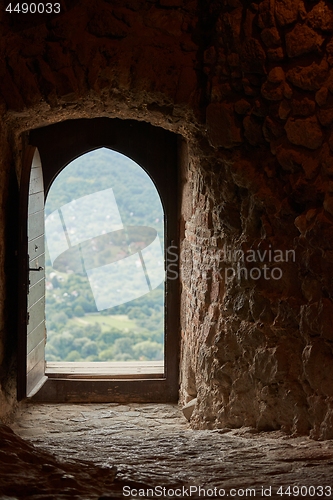 Image of Passage of an old castle, open door
