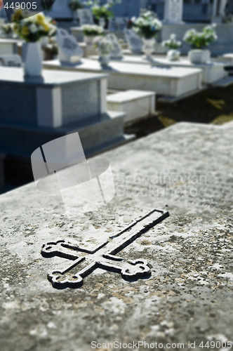 Image of Cross engraved in a tombstone