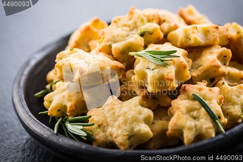 Image of Delicious homemade cookies with parmesan cheese and rosemary