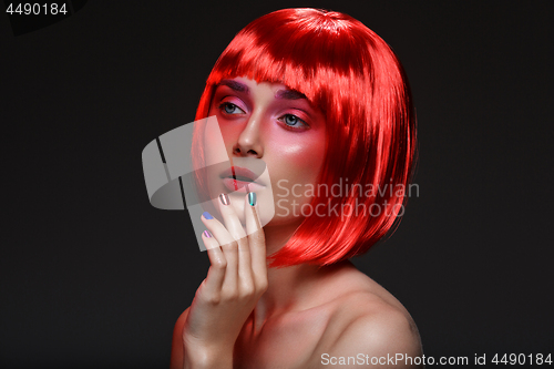 Image of Beautiful girl in red wig