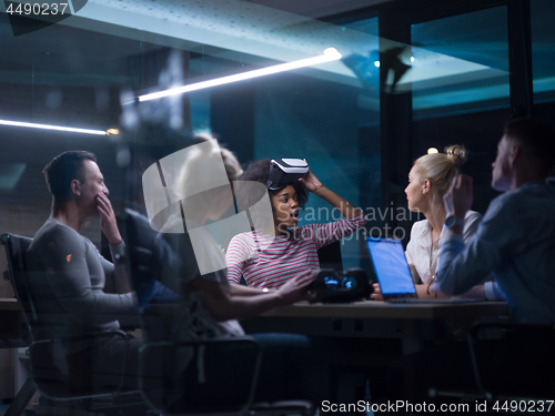 Image of Multiethnic Business team using virtual reality headset