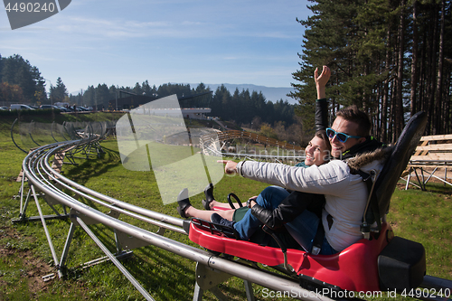 Image of couple enjoys driving on alpine coaster