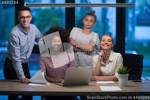 Image of Multiethnic startup business team in night office