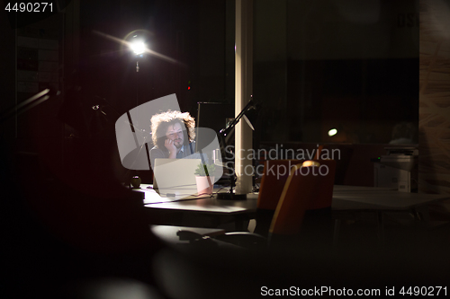 Image of businessman relaxing at the desk