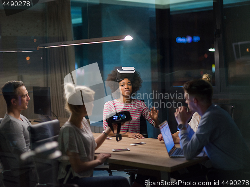 Image of Multiethnic Business team using virtual reality headset