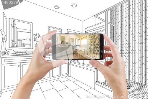 Image of Hands Holding Smart Phone with Master Bathroom Photo on Screen a