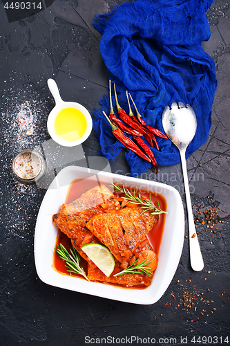 Image of fish with tomato sauce 