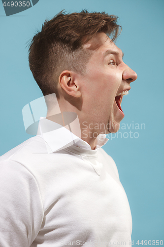 Image of Isolated on pink young casual man shouting at studio