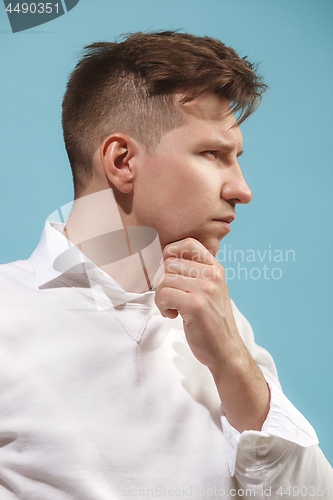 Image of Beautiful bored man isolated on studio background