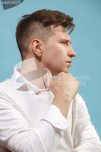Image of Beautiful bored man isolated on studio background