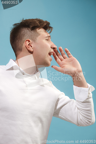 Image of Isolated on pink young casual man shouting at studio