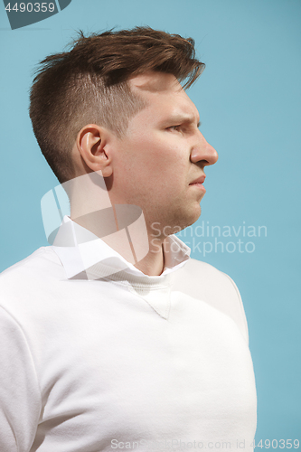 Image of Beautiful bored man isolated on studio background