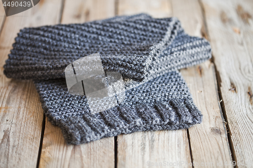 Image of knitted dark grey scarf