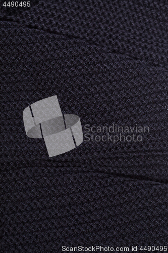 Image of Knitted black scarf texture