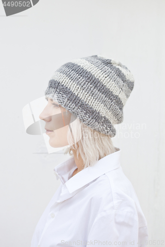 Image of Beautiful young woman in warm grey beanie