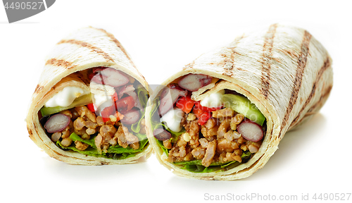 Image of Tortilla wrap with fried minced meat and vegetables