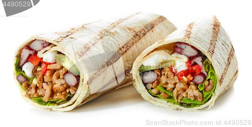 Image of Tortilla wrap with fried minced meat and vegetables