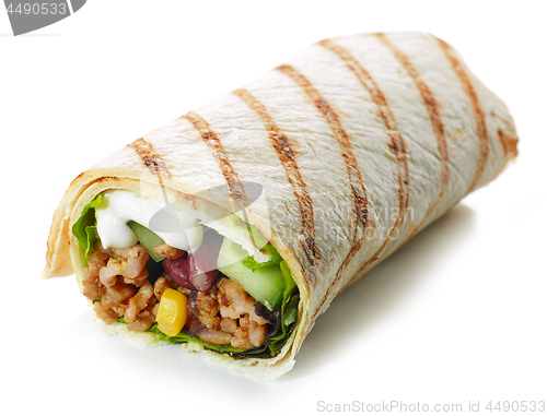 Image of Tortilla wrap with fried minced meat and vegetables