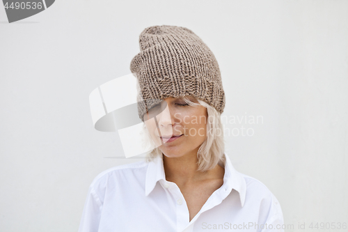 Image of Pretty young woman in warm brown beanie