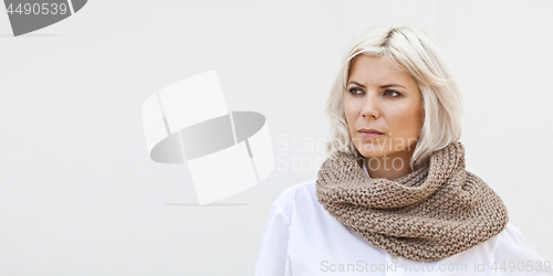 Image of Woman in warm beige wool knitted snood