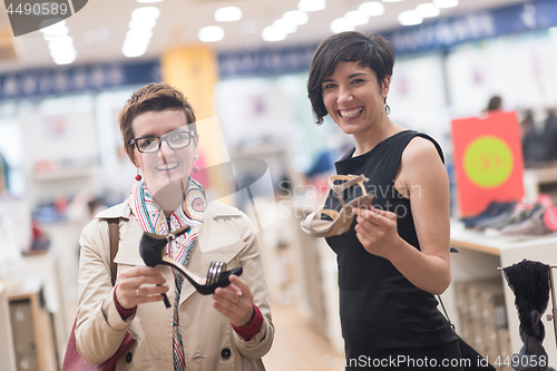 Image of best friend shopping in big mall