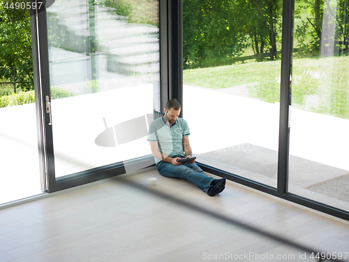 Image of man on the floor enjoying relaxing lifestyle