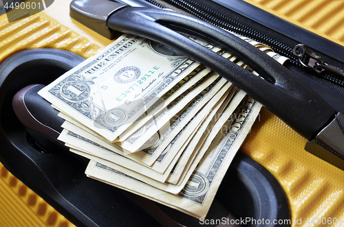 Image of Suitcase with US Dollar banknotes