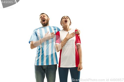 Image of The Argentinean soccer fan celebrating on white background