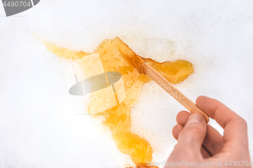 Image of Sweet maple taffy on white snow