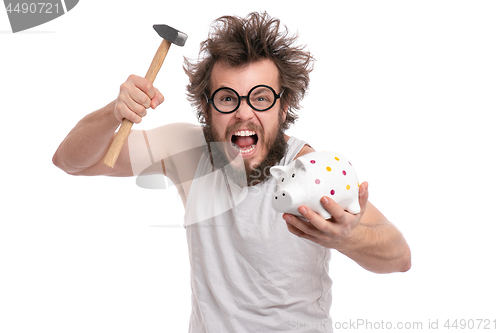 Image of Crazy bearded man with piggy bank