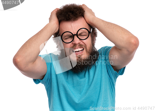 Image of Crazy bearded man has headache