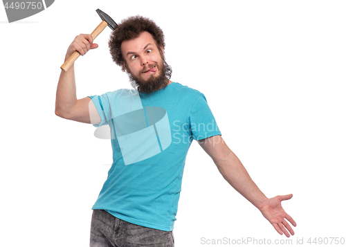 Image of Crazy bearded man with hammer