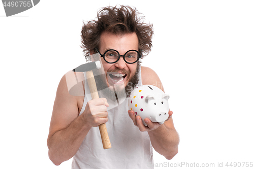 Image of Crazy bearded man with piggy bank