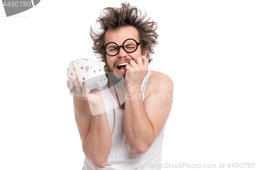 Image of Crazy bearded man with piggy bank