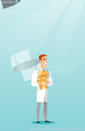 Image of Pediatrician doctor holding teddy bear.