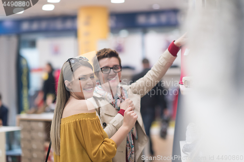 Image of best friend shopping in big mall